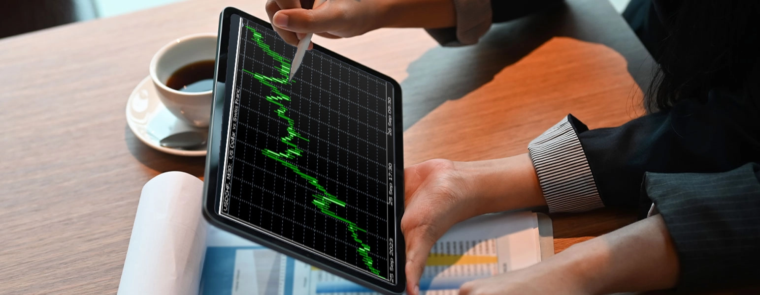 Forex trader analyzing charts and data for short and long-term trading decisions